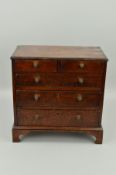 A GEORGE III OAK MINIATURE CHEST OF DRAWERS, two short over three long graduated, with metal knob