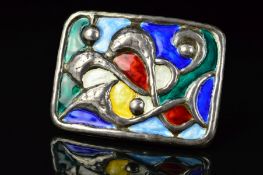 A NORWEGIAN ENAMEL BROOCH BY OYSTEIN BALLE, of rectangular outline with embossed scrolling and