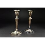 A PAIR OF ELIZABETH II SILVER CANDLESTICKS, of wavy oval outline, detachable sconces, tapering stems