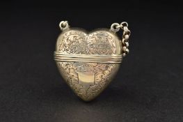 A VICTORIAN SILVER HEART SHAPED VINAIGRETTE, with suspension loop and short chain, the heart