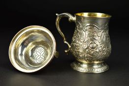 A GEORGE III SILVER MUG, of baluster form, gilt interior, 'S' scroll handle, cartouche engraved with