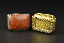 A GEORGE III SILVER RECTANGULAR VINAIGRETTE, the hinged cover inset with a goldstone panel, gilt