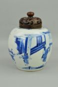 A CHINESE PORCELAIN BLUE AND WHITE DECORATED GLOBULAR JAR, with pierced hardwood cover, the jar