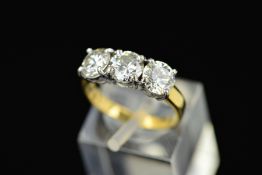 A LATE 20TH CENTURY 18CT GOLD THREE STONE DIAMOND RING, estimated modern round brilliant cut diamond