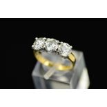 A LATE 20TH CENTURY 18CT GOLD THREE STONE DIAMOND RING, estimated modern round brilliant cut diamond