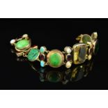 A VINTAGE MULTI GEM AND CARVED INTAGLIO PANEL LINK BRACELET, various gemstones and cuts and sizes,