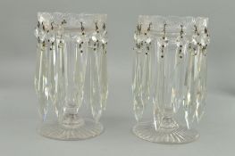 A PAIR OF VICTORIAN CLEAR GLASS LUSTRES, scalloped rims holding fourteen facet cut droppers,