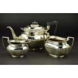 A LATE VICTORIAN SILVER THREE PIECE TEA SERVICE, of oval form, gadrooned rims, reeded decoration,