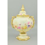 A GRAINGER & CO WORCESTER TWIN HANDLED URN AND COVER, of squat baluster form, blush ivory ground,