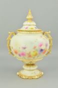 A GRAINGER & CO WORCESTER TWIN HANDLED URN AND COVER, of squat baluster form, blush ivory ground,