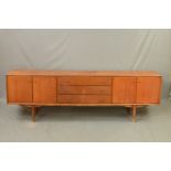 AN EVEREST 7FT TEAK SIDEBOARD, flanked by two double cupboard doors and three central drawers,