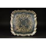 A GEORGE VI SILVER SALVER, of wavy square form, pie crust border foliate engraved decoration, on