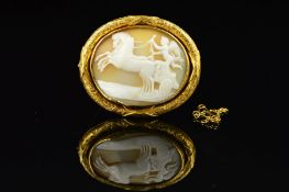 A MID VICTORIAN GOLD MEMORIAL CAMEO BROOCH, oval shell cameo depicting a winged cherub in a