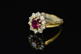 A LATE 20TH CENTURY 18CT GOLD RUBY AND DIAMOND OVAL CLUSTER RING, centring on an oval mixed cut ruby