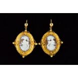 A PAIR OF MID VICTORIAN CAMEO EAR PENDANTS, two shell cameo depicting different adaptations of