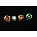 FOUR MODERN ROUND BRILLIANT COLOURED DIAMONDS, approximate total weight 1.33ct, two green and two