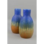 A PAIR OF RUSKIN A9 SHAPED VASES, with a matt blue glaze over a gloss orange, impressed Ruskin