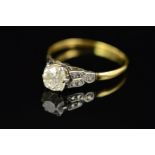 A LATE 19TH CENTURY TO EARLY 20TH CENTURY GOLD SINGLE STONE DIAMOND RING, one old cushion diamond,