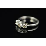 A MODERN PLATINUM THREE STONE DIAMOND RING, estimated modern round brilliant cut weight 1.20ct,