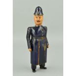 A LATE VICTORIAN CARVED WOOD NOVELTY POLICEMAN, painted finish, his swivel head causing the front of
