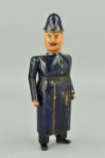 A LATE VICTORIAN CARVED WOOD NOVELTY POLICEMAN, painted finish, his swivel head causing the front of