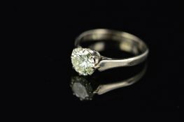 A LATE 20TH CENTURY DIAMOND SINGLE STONE RING, a modern round brilliant cut diamond, claw set,