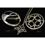 THREE ITEMS OF JEWELLERY BY OLA M. GORIE, to include circular openwork brooch with scrolling