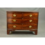 AN EARLY 19TH CENTURY MAHOGANY BOW FRONT CHEST OF TWO SHORT OVER TWO LONG GRADUATED DRAWERS,