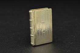 A WILLIAM IV SILVER NOVELTY VINAIGRETTE, of book form, engine turned decoration, blind rectangular