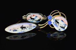 THREE NORWEGIAN ENAMEL BROOCHES BY ASKEL HOLMSEN, the first a rounded shape depicting an enamel