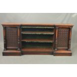 A VICTORIAN BURR WALNUT AND ROSEWOOD BOOKCASE, of inverted breakfront form, moulded edge above three