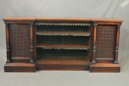 A VICTORIAN BURR WALNUT AND ROSEWOOD BOOKCASE, of inverted breakfront form, moulded edge above three