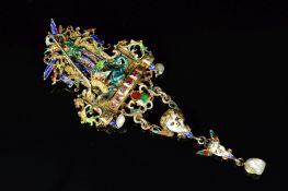 A 19TH CENTURY AUSTRO HUNGARIAN LARGE BROOCH, depicting a winged figure slaying a dragon, suspending