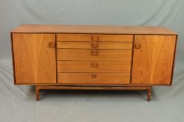 IB KOFOD LARSEN FOR G PLAN, a teak sideboard flanked by single cupboard doors and five central