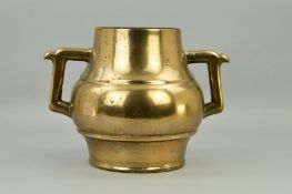 A CHINESE BRONZE TWIN HANDLED CENSOR OR JAR, of baluster form, height approximately 25cm (condition: