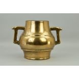 A CHINESE BRONZE TWIN HANDLED CENSOR OR JAR, of baluster form, height approximately 25cm (condition: