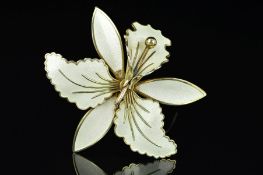 A NORWEGIAN ENAMEL BROOCH BY ASKEL HOLMSEN, designed as a white guilloche enamel lily, with maker'