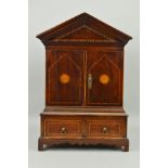 A GEORGE III STYLE MAHOGANY AND INLAID MINIATURE CABINET, of architectural form, the double doors