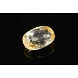 A PALE YELLOW MIXED CUT SAPPHIRE, measuring approximately 14.6mm x 10mm x 5.7mm, weighing