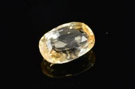 A PALE YELLOW MIXED CUT SAPPHIRE, measuring approximately 14.6mm x 10mm x 5.7mm, weighing