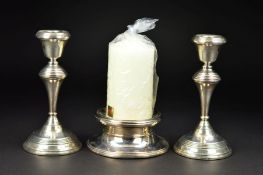 A PAIR OF ELIZABETH II SILVER CANDLESTICKS, of circular form, with stepped concentric bands to