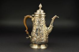 A GEORGE II SILVER COFFEE POT, of baluster form, hinged cover with urn finial, wooden handle, the