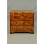A GEORGE II STYLE WALNUT AND STAINED PINE CHEST OF TWO SHORT AND THREE LONG GRADUATED DRAWERS,