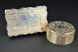 A VICTORIAN SILVER OVAL VINAIGRETTE, the hinged cover and base engraved with foliate scrolls, the