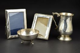 A GEORGE VI SILVER BALUSTER SHAPED TANKARD, cast 'S' scroll handle, stepped circular base with