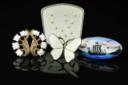 FOUR DESIGNER NORWEGIAN ENAMEL BROOCHES, to include a white enamel floral brooch by Monster