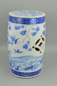 A JAPANESE MEIJI PERIOD BLUE AND WHITE DECORATED GARDEN SEAT, of barrel shape with pierced sides,