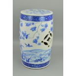 A JAPANESE MEIJI PERIOD BLUE AND WHITE DECORATED GARDEN SEAT, of barrel shape with pierced sides,