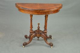 A VICTORIAN BURR WALNUT DEMI LUNE FOLD OVER CARD TABLE, revealing a green baize interior, on four