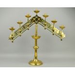 A VICTORIAN BRASS GOTHIC ECCLESIASTICAL SEVEN LIGHT CANDELABRUM, with ratchet fittings to both